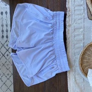LULULEMON NWOT “track that” short 5”, zip pocket